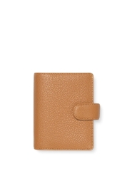 The Norfolk Pocket Organiser in a stunning almond shade is a luxurious blend of style and practicality, featuring a soft, full-grain leather cover inspired by the idyllic Norfolk countryside. With a 25mm ring capacity, zip pockets, card holders, and an elastic pen loop, it's the perfect organiser for the efficient multitasker. Encased in a unique box, it makes an elegant gift for those who appreciate quality and sophistication.