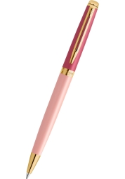 The Hémisphére Colour Blocking GT Ballpoint Pen in pink is a luxurious writing tool, with a stunning lacquered brass body complemented by 23-carat gold-plated accessories. This slim, sleek pen combines intricate design with a rotary mechanism for smooth writing, and comes with a standard blue refill. Presented in an elegant gift box, it's the perfect choice for those seeking style, excellence and a touch of extravagance in their everyday stationery.
