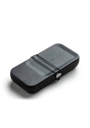 Discover the ultimate convenience with the Nest Case with Wireless Charger in sophisticated black. This versatile case, crafted with a high-quality leather surface and durable polycarbonate core, not only organises your essentials but also wirelessly charges your devices. Customise the interior to suit your needs and experience the blend of style, function and technology.